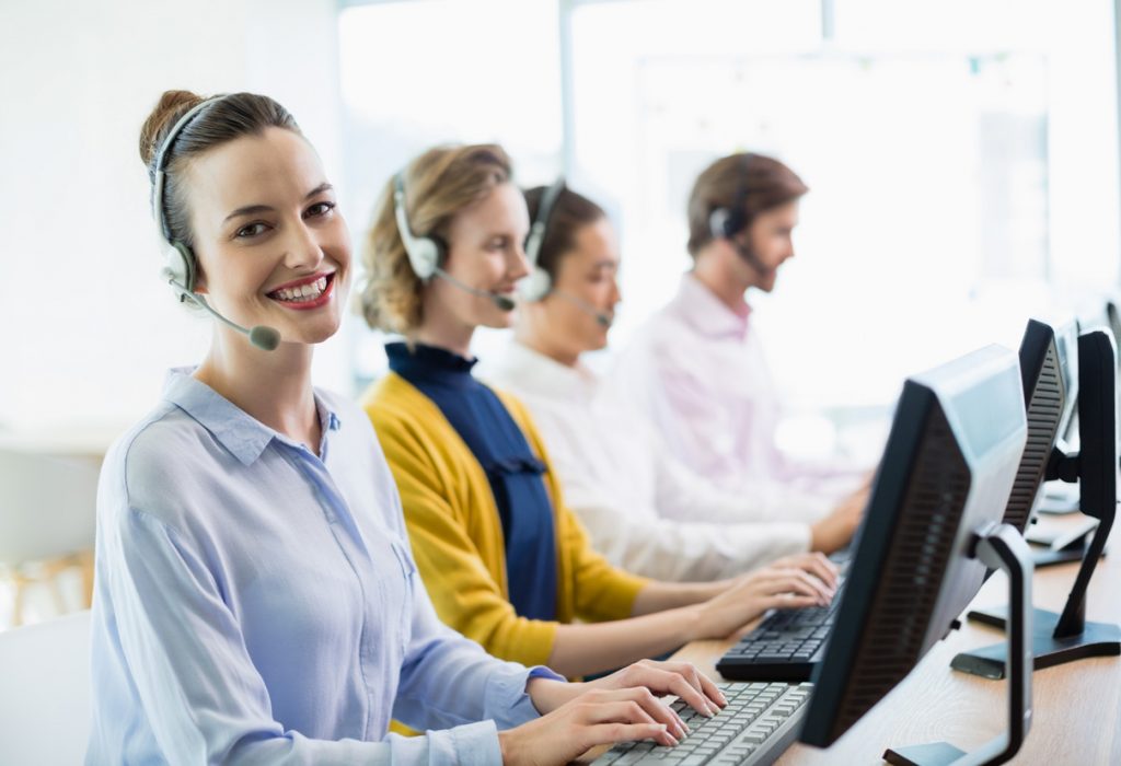 Customer service executives working in call center Team of customer service executives working in call center